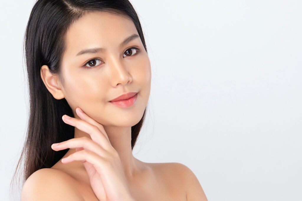 Close-up of a woman with glowing skin